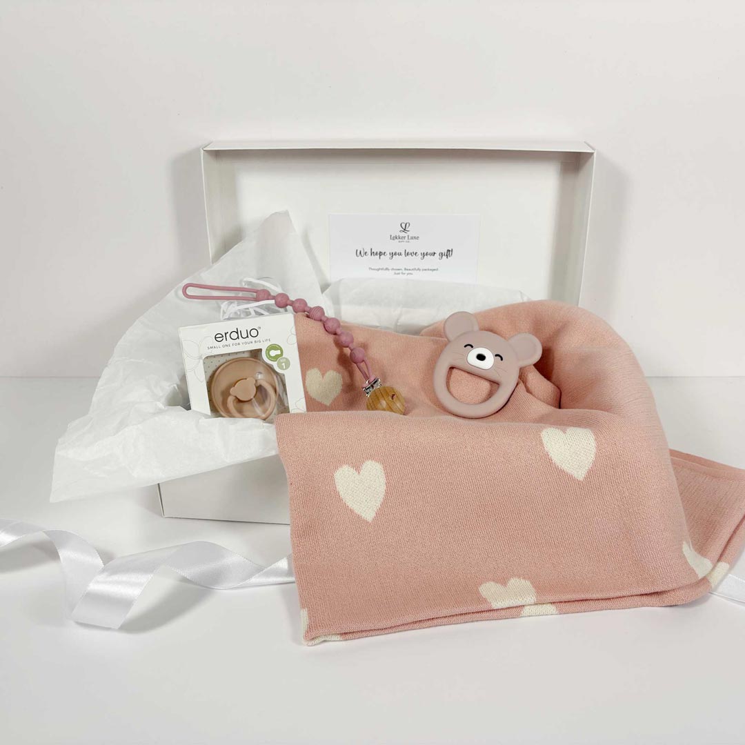 essential baby girl gift box displayed on table