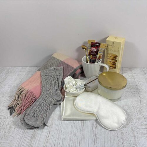 cozy box pink contents displayed on table