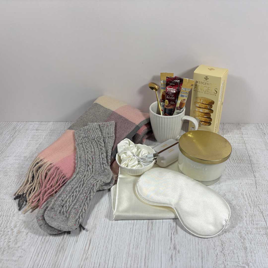 cozy box pink contents displayed on table