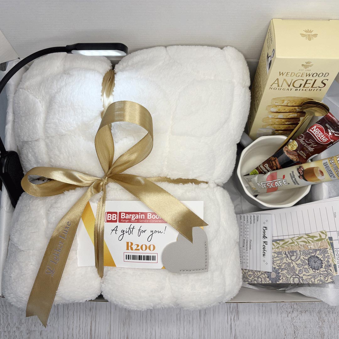 The Cosy Chapter luxury book lover gift box with soft blanket, reading light, mug, treats, reading accessories and bookshop voucher